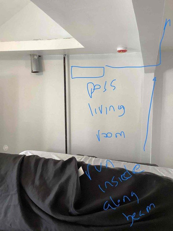 Conducted furnace replacement estimate for residential property where existing heating system had been stolen. Assessed living room area with visible wall markings indicating previous gas furnace installation location, documented existing electrical outlet and concrete floor conditions, and provided recommendations for new gas heating system installation to restore climate control to the unheated dwelling.