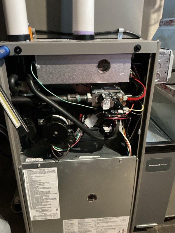 Completed comprehensive furnace tune-up and maintenance on American Standard unit located in basement, approximately 0.75 years old, as part of preventative maintenance plan. Performed full system inspection including visual examination of all internal components, gas valve assembly, blower motor, electrical connections, and control board. Verified proper operation of PVC intake and exhaust venting system. Tested and measured temperature differential across heat exchanger. Inspected all wiring harnesses and connections for secure attachment and proper routing. Confirmed gas pressure and combustion performance within manufacturer specifications. Verified thermostat communication and system cycling. All components found operating within normal parameters with no deficiencies noted. Unit is functioning properly and ready for heating season.