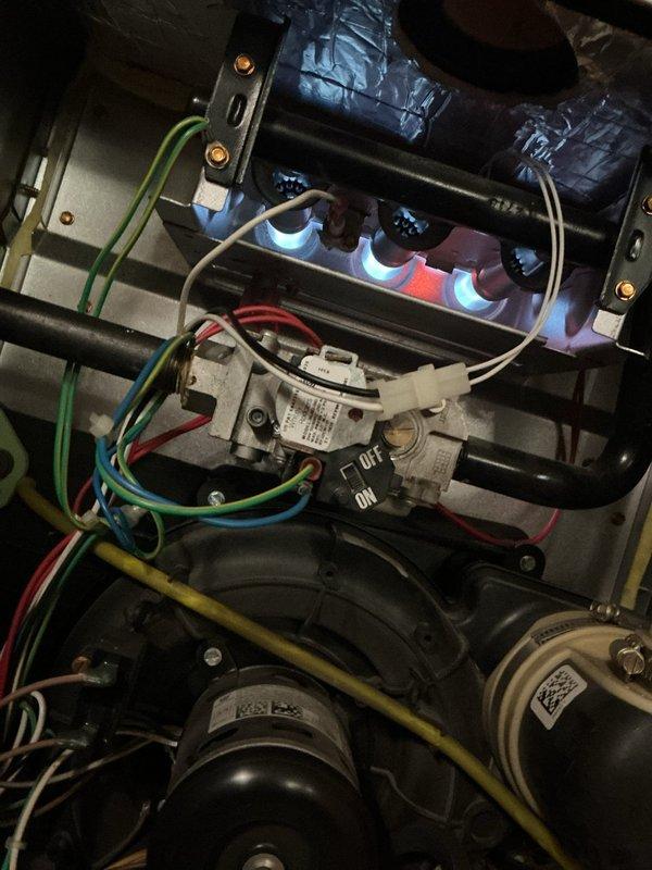 Responded to no heat call on 8-year-old Bryant 95% single-stage furnace in basement. Upon arrival, verified thermostat was calling for heat but unit was delivering cool air only. Inspected furnace and found burners igniting properly with stable blue flames present. Diagnosed issue as faulty limit switch preventing blower from engaging during heat cycle. Replaced defective limit switch, tested system through multiple heating cycles, and confirmed proper operation with warm air delivery at registers. Unit restored to full heating functionality.