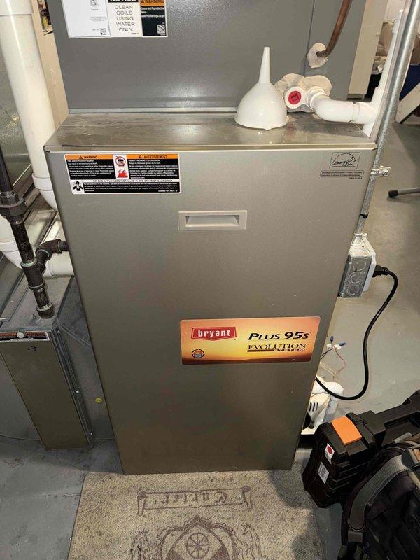 Completed Gold Furnace Inspection on a 10+ year old Bryant Plus 95s Evolution high-efficiency furnace located in basement. Performed comprehensive system evaluation including visual inspection of heat exchanger, burner assembly, and all safety controls. Verified proper operation of ignition system and flame sensor. Tested electrical components using digital multimeter to confirm proper voltage and amperage readings across control board and safety circuits. Inspected all venting connections including PVC intake and exhaust pipes for proper sealing and clearances. Checked condensate drain system and pump operation. Evaluated blower motor performance and inspected electrical connections throughout unit. Confirmed proper gas pressure and manifold readings. All safety devices tested and functioning within manufacturer specifications. Unit operating normally with no issues found at time of inspection.