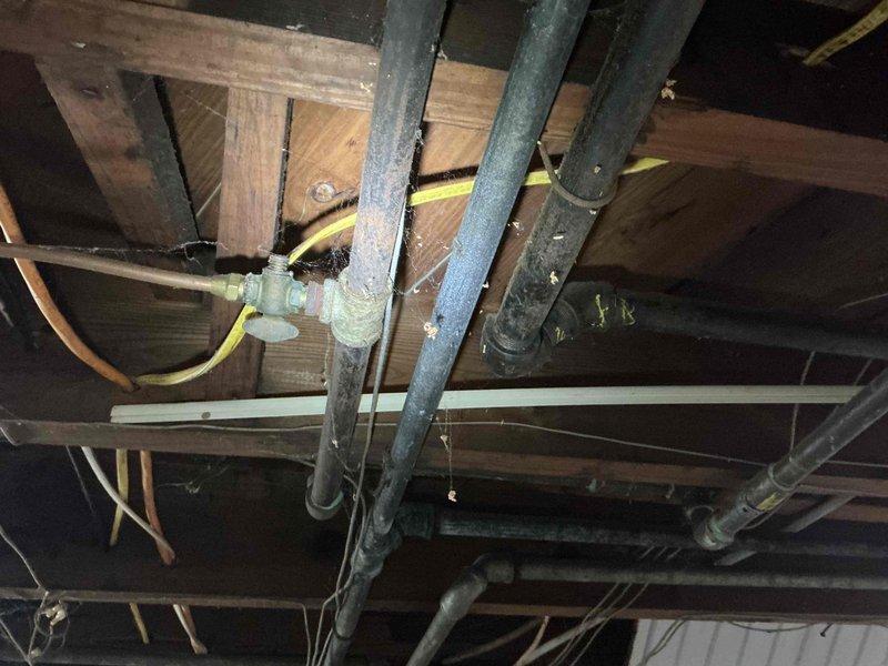 Responded to emergency gas service call where utility company had shut off gas supply and tagged six separate leak locations in basement mechanical area. Conducted comprehensive pressure testing and leak assessment of existing gas piping system, including aged copper supply lines, connections at water heater, and distribution piping throughout basement space. Documented all tagged leak points for repair evaluation and provided technical assessment to restore safe gas service to residence.