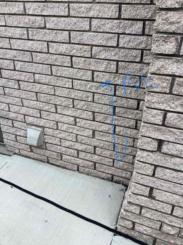 Conducted comprehensive site assessment for complete HVAC system replacement, including furnace and air conditioning unit. Evaluated existing outdoor condensing unit location against brick exterior wall, documented current equipment condition and installation area, and photographed proposed equipment placement zones marked on exterior wall. Assessed refrigerant line routing, electrical conduit pathways, and ground-level installation conditions to provide accurate full system replacement estimate.