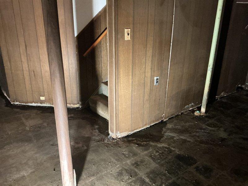 Responded to clogged kitchen sink at residential property. Upon arrival, performed diagnostic assessment of drainage system. Inspected basement utility area beneath kitchen to evaluate plumbing infrastructure and identify source of blockage. Documented existing conditions including water staining on concrete floor and visible moisture damage throughout basement area, indicating potential long-term drainage issues. Examined PVC drain lines and connections for obstructions, corrosion, and proper flow. Cleared blockage from kitchen sink drain line to restore proper drainage function. Advised customer of underlying moisture concerns observed in basement that may require future attention to prevent additional plumbing complications.