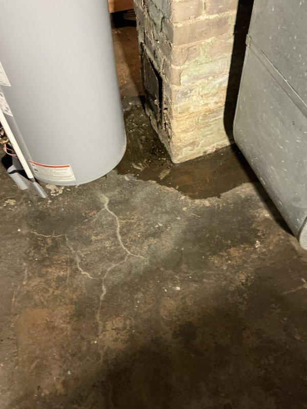Returned to property following gas service restoration to assess 2018 State water heater previously installed under 10-year warranty. Upon inspection, confirmed tank failure with active leak at bottom of unit causing significant water pooling and moisture damage to basement concrete floor. Determined tank was not repairable due to compromised integrity of vessel. Removed failed 40-gallon gas water heater and installed new 40-gallon State brand gas water heater as warranty replacement. Connected all gas supply lines, water supply and discharge piping with copper connections. Verified proper venting configuration and clearances. Filled tank, purged air from system, and tested all connections for leaks. Lit pilot, verified burner operation, and confirmed proper heating cycle. Reviewed operation and maintenance requirements with homeowner. Unit operating properly at time of departure with no leaks detected.