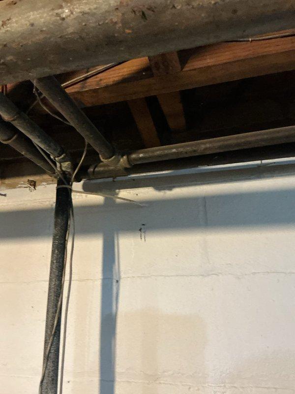 Responded to emergency gas leak call where utility company had shut off and tagged gas supply to multiple appliances. Upon arrival, inspected furnace, water heater, and three additional locations previously identified by utility company. Conducted thorough visual inspection of all gas piping, connections, and joints throughout basement utility area. Examined aging copper and brass gas lines showing significant corrosion and patina, particularly at junction points and bends along foundation walls. Documented all tagged locations and deteriorated piping conditions with photographic evidence. Assessed pipe integrity and identified multiple areas requiring immediate attention before gas service restoration. Provided detailed findings and recommendations for necessary repairs to bring system into compliance with current safety codes and utility company requirements for reconnection.