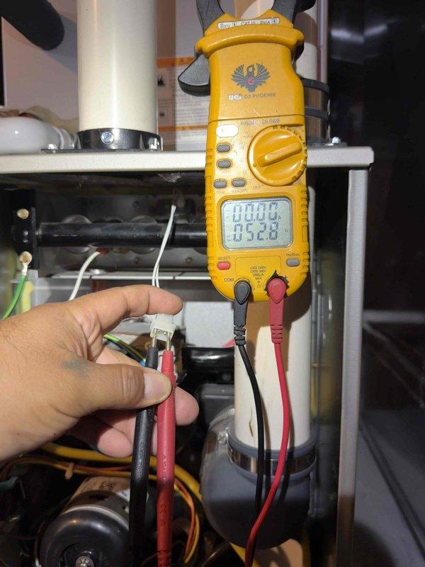 Completed comprehensive Gold furnace inspection on 10+ year old forced air unit located in basement. Performed thorough diagnostic testing using digital multimeter to verify electrical connections and voltage readings across system components. Conducted internal visual inspection of heat exchanger and ductwork using borescope camera to assess condition and identify any potential cracks, corrosion, or deterioration. All electrical connections tested within normal parameters, and visual inspection revealed no immediate safety concerns or structural defects in accessible components. Unit currently operating as designed with no service issues identified at time of inspection.