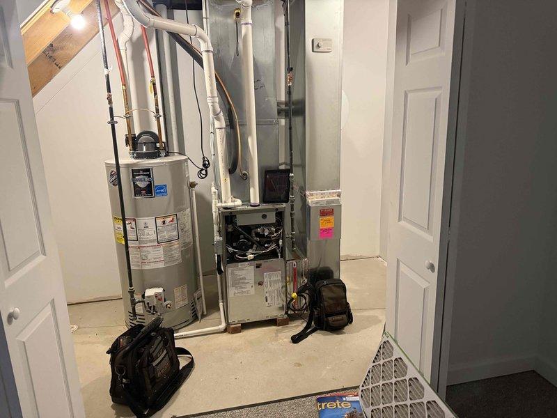 Completed comprehensive Gold-level furnace inspection on 6-year-old Lennox EL296UH series unit located in basement. Verified proper operation of forced-air heating system, inspected blower assembly and motor performance specifications, examined all safety controls and limit switches, checked heat exchanger for cracks or deterioration, tested gas pressure and burner operation, verified proper venting and combustion air supply, inspected electrical connections and wiring, measured temperature rise across heat exchanger, and confirmed proper thermostat operation. Reviewed manufacturer's blower performance data to ensure airflow specifications aligned with system requirements across various external static pressure readings. Examined water heater installation in same mechanical room for clearance compliance. All components found operating within normal parameters with no immediate safety concerns identified. Unit passing all inspection criteria for Gold maintenance service level.