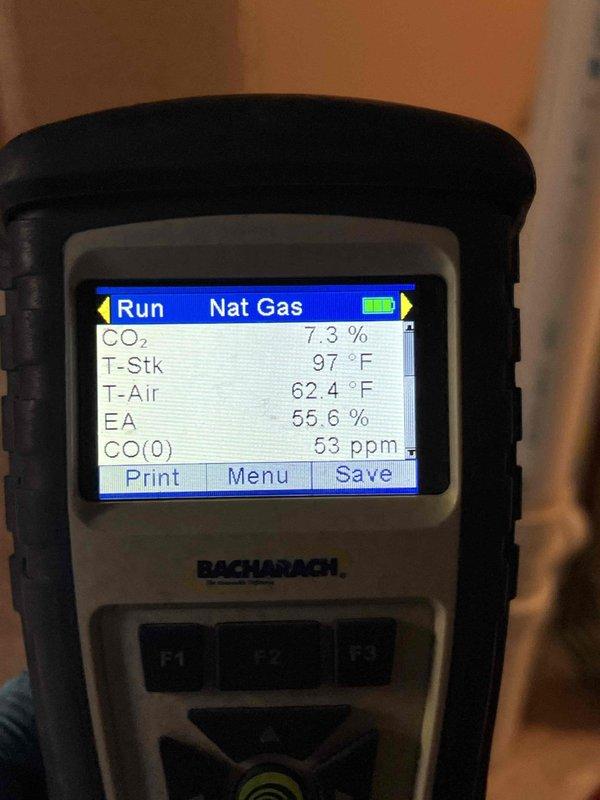 Completed Gold-level furnace inspection on 10+ year old forced air system located in basement. Performed comprehensive combustion analysis using Bacharach analyzer, confirming proper operation with CO2 reading of 7.3%, stack temperature of 97°F, ambient air temperature of 62.4°F, excess air at 55.6%, and CO reading of 53 ppm—all within acceptable parameters. Inspected horizontal air handler unit, associated ductwork, and plumbing connections, documenting equipment condition with photos for service records.