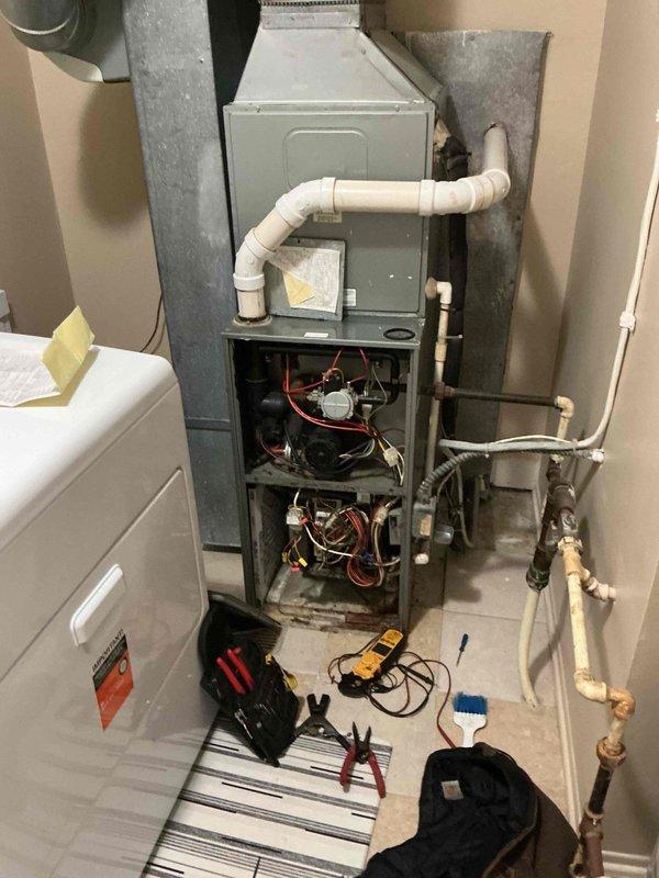 Responded to no heat call for furnace located in laundry room utility closet. Upon arrival, performed diagnostic testing with multimeter to check electrical components and circuitry. Removed front access panel to inspect internal components, wiring connections, and control boards. Verified gas supply line connections and pressure, checked PVC condensate drain lines for proper operation, and tested all safety switches and limit controls. Identified and resolved issue preventing furnace ignition sequence, restoring heat to residence. System tested and confirmed operational before departure.