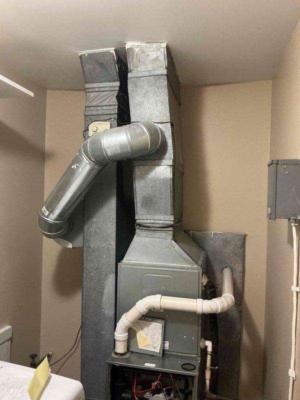 Responded to no heat call for furnace located in laundry room utility closet. Upon arrival, performed diagnostic testing with multimeter to check electrical components and circuitry. Removed front access panel to inspect internal components, wiring connections, and control boards. Verified gas supply line connections and pressure, checked PVC condensate drain lines for proper operation, and tested all safety switches and limit controls. Identified and resolved issue preventing furnace ignition sequence, restoring heat to residence. System tested and confirmed operational before departure.