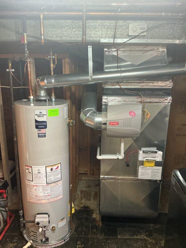 Completed comprehensive Gold-level furnace inspection on 12-year-old forced air heating system located in basement. Performed full system evaluation including visual inspection of furnace cabinet, heat exchanger, burner assembly, blower motor, and all safety controls. Verified proper operation of White-Rodgers programmable thermostat and confirmed system responds correctly to temperature calls. Inspected venting system, gas connections, and condensate drainage. All components found operating within normal parameters with no immediate safety concerns identified.