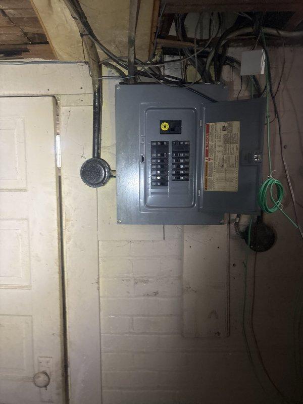 Responded to a no-power call where half the residence initially lost power, homeowner replaced fuses with temporary restoration, then experienced complete power loss to the other half of the home. Upon arrival, performed comprehensive inspection of main electrical panel and circuit breaker configuration. Evaluated all circuit breakers for proper operation, checked for signs of overheating, loose connections, or damaged breakers. Inspected main disconnect switch and verified proper panel grounding. Documented panel condition with photographs showing dual-row breaker arrangement and overall electrical distribution system. Assessed incoming service conductors and conduit connections for integrity. Tested affected circuits to isolate the source of intermittent power loss and subsequent complete outage. Identified underlying electrical issue causing progressive power failure throughout the residence and provided recommendations for necessary repairs to restore full electrical service safely