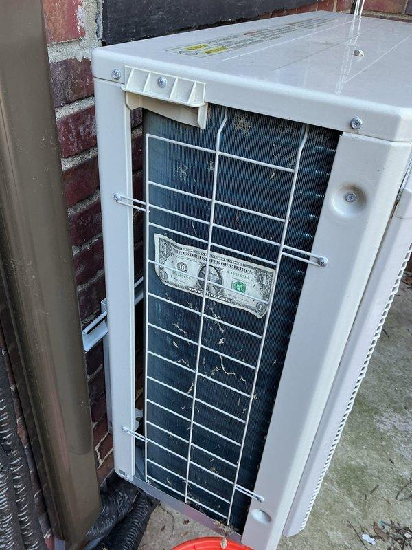 Responded to service call for mini split system displaying U4 error code with no heating or cooling capability on unit installed within past year. Upon arrival, inspected outdoor condenser unit and electrical disconnect box mounted on exterior brick wall. Diagnosed communication fault between indoor and outdoor units causing U4 error. Verified all electrical connections at disconnect box, checked circuit breakers, and inspected line set connections. Tested surge protection device labeled ICM517A for proper operation. Cleared error code, restored system communication, and verified unit returned to normal heating and cooling operation. System tested and confirmed fully operational upon departure.