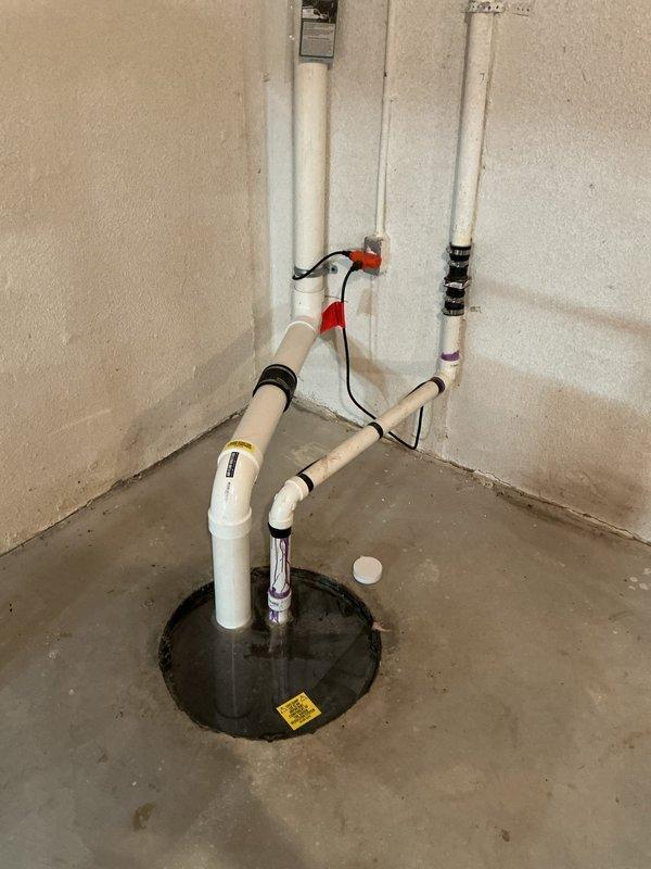 Installed new kitchen faucet and battery backup sump pump system per approved estimate. The backup pump installation included proper PVC discharge piping configuration with check valves and connection to existing primary sump pump basin to provide emergency drainage protection during power outages.