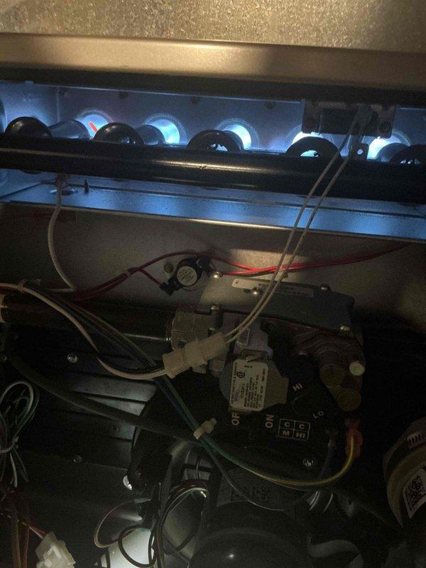 Completed comprehensive Gold furnace inspection on 9-year-old gas-fired heating system located in basement. Verified proper burner operation with blue flame combustion pattern and inspected gas valve assembly, electrical connections, and wiring harness. Performed diagnostic testing using digital multimeter to measure system temperatures and operational parameters. All components found operating within normal specifications with no immediate service needs identified.