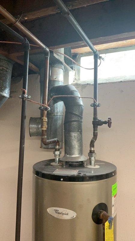 Completed comprehensive tune-up and maintenance on 8-year-old Lennox Elite Series furnace located in basement. Performed full system inspection including combustion analysis, pressure testing with dual port manometer showing proper gas pressure readings at 394, verified all electrical connections and control board operation, inspected heat exchanger for cracks or deterioration, cleaned burner assembly, and tested safety controls. Inspected Healthy Climate HCWB3-12 Compact Bypass Humidifier and replaced humidifier pad as part of seasonal maintenance. All components operating within manufacturer specifications, system tested and confirmed functioning properly for heating season.