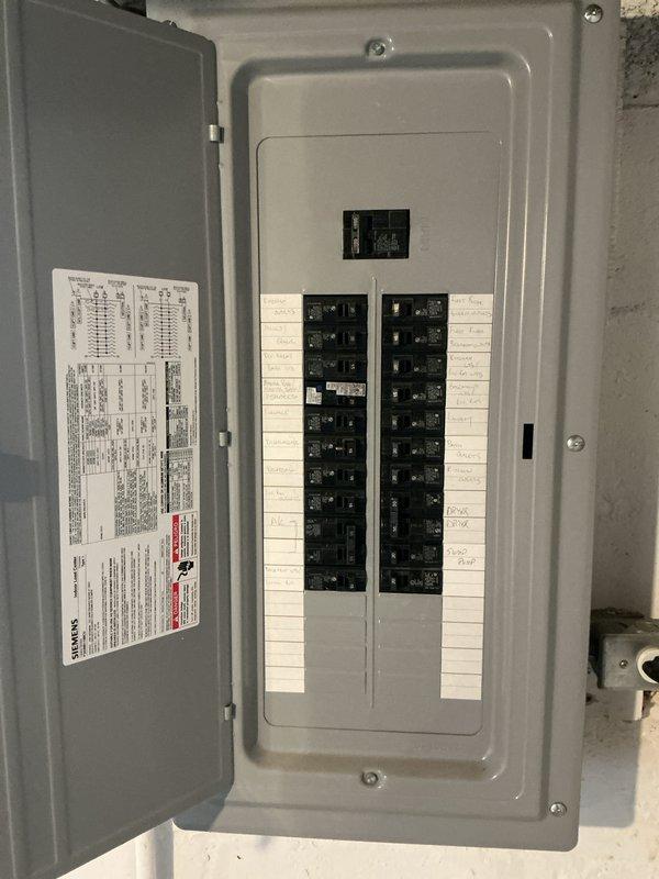 Completed annual winter furnace inspection and tune-up on basement-installed heating unit of unknown age as part of Flame Fixed Membership service. During the visit, conducted comprehensive evaluation of the existing HVAC system, including assessment of the furnace unit, electrical panel connections, ductwork configuration, and exhaust venting system. Documented current system conditions through detailed photography, capturing the electrical distribution panel with circuit breaker arrangement, the main furnace unit positioned against brick wall with metal exhaust piping, black flexible ductwork installation, and PVC condensate drain components. Based on findings from the inspection, provided full system estimate for replacement considerations, identifying the furnace age as undetermined and evaluating overall system performance and efficiency. Noted existing installation features including segmented exhaust elbows, flexible duct runs secured to ceiling joists, and proper venting config