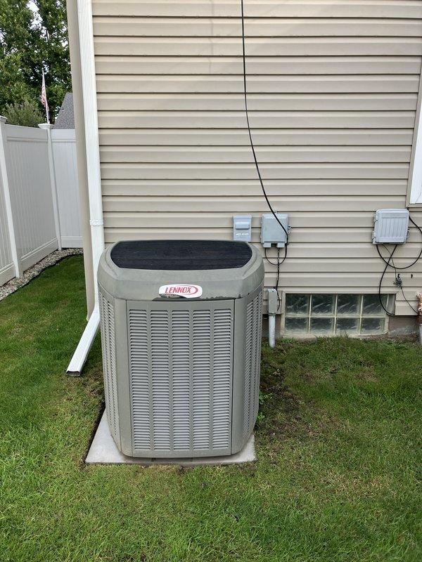 Conducted comprehensive full system replacement estimate for 20-year-old Lennox G61MPV furnace and Lennox XC15 air conditioning system, both located in basement. Evaluated existing outdoor condensing unit positioned on concrete pad with proper clearances, inspected electrical disconnect and conduit connections along exterior wall, and assessed overall system condition and installation accessibility. Documented equipment specifications, reviewed current system performance limitations due to age, and provided recommendations for modern high-efficiency replacement options to improve home comfort and energy efficiency.