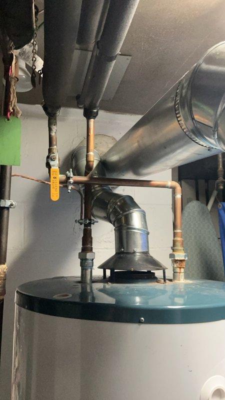Responded to service call for moisture detected beneath newly installed boiler in basement. Upon inspection, identified minor leak at brass valve fitting on supply line connection. Tightened valve connection and verified all plumbing joints for proper seal. Monitored system during operation cycle with no further moisture detected. Unit returned to normal operation with all connections secure.