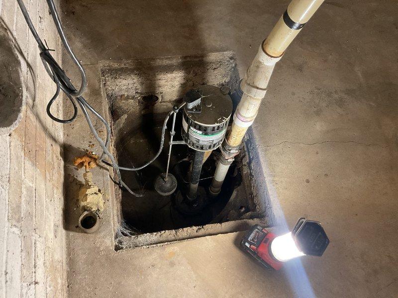Responded to service call for sump pump system not receiving water due to suspected clogged drainage pipes. Upon inspection of the basement sump pit, assessed the submersible pump unit, PVC discharge piping, and associated drainage infrastructure. Cleared blockage from inlet drainage pipes to restore proper water flow to the sump pump valve, tested system operation to verify pump activation and discharge function, and confirmed all components were functioning correctly.