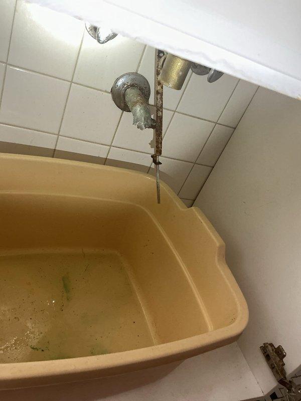 Completed diagnostic evaluation of deteriorated bathroom sink piping with aged, brittle supply lines and wall-mounted connections requiring replacement. Assessed threadless pipe protruding from wall with difficult removal conditions and documented exposed plumbing fixtures showing significant wear and corrosion. Provided on-site estimate for complete pipe replacement work.