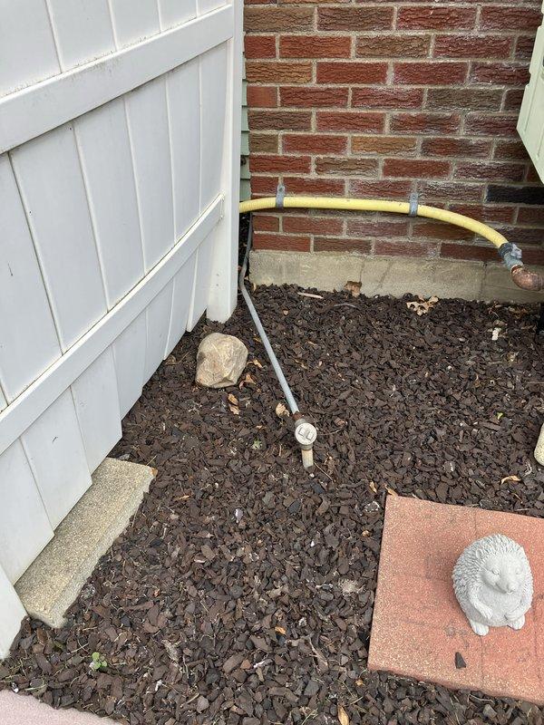 Completed on-site evaluation for packaged HVAC unit replacement at medium-sized residential property (1500-3000 sq.ft.). Assessed existing heating and cooling system with natural gas energy source, documented current unit location on exterior wall with stone veneer cladding, photographed gas line connections and utility access points in mulched side yard area, and provided comprehensive replacement estimate for new packaged unit system.