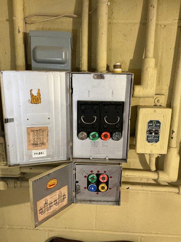 Completed maintenance tune-up on approximately 15-year-old first floor furnace with no reported issues or symptoms. Inspected air handler unit, electrical control panels, and associated mechanical systems in utility room. Documented existing HVAC equipment configuration including water heater connections, PVC drainage lines, electrical components, and control panels to provide comprehensive system assessment for future replacement considerations.
