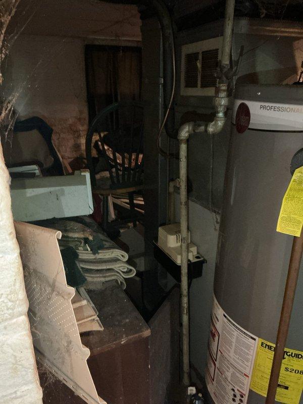 Responded to heating concern from previous winter season for preventative inspection prior to upcoming heating season. Upon arrival, located equipment in basement utility area. Inspection revealed water heater present but no furnace visible in photographed areas. Unable to complete requested furnace inspection as heating appliance could not be identified or accessed in the documented service area. Recommend customer verify location of heating equipment for proper seasonal maintenance evaluation.