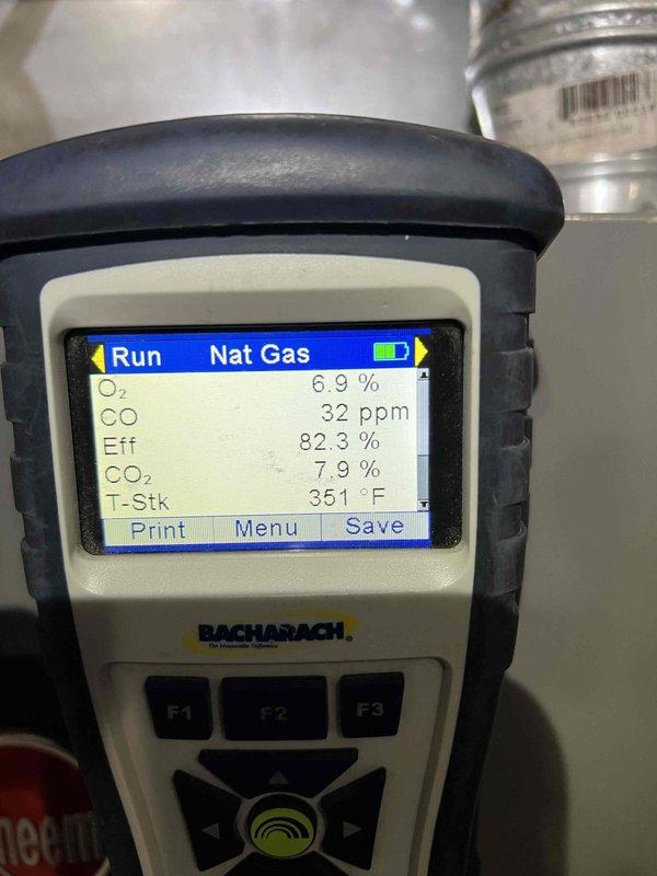 Completed comprehensive city certification inspection on a 9-year-old furnace system (Model R801SA075417ZSB, manufactured 11/2016) located in utility closet. Performed full system tune-up including combustion analysis which revealed proper operation with O2 at 6.9%, CO at 32 ppm, efficiency at 82.3%, CO2 at 7.9%, and stack temperature at 351°F. Inspected and evaluated humidifier, thermostat, and hot water tank as part of rental property certification requirements, with all components functioning within acceptable parameters and system tagged accordingly for city compliance.