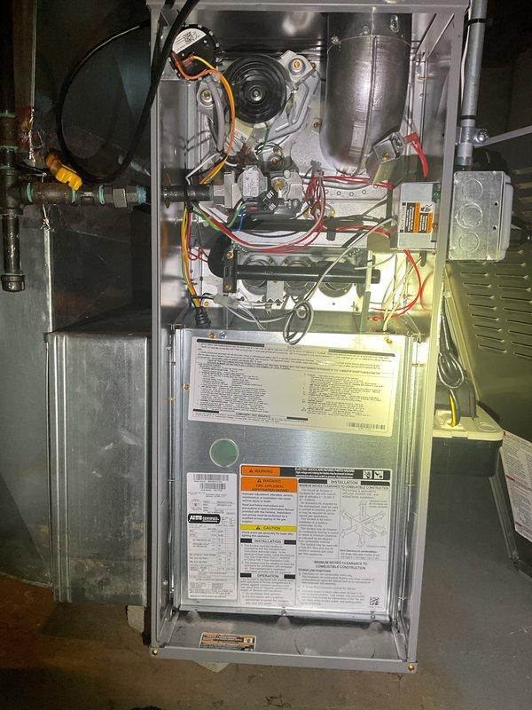 Completed comprehensive furnace inspection and tune-up on 6-year-old residential heating unit located in basement. Performed thorough visual examination of all internal components including blower motor assembly, draft inducer, heat exchanger, and electrical connections. Verified proper operation of all safety controls, checked gas connections and fittings for leaks, and inspected venting system for proper draft and clearances. All components found to be operating within manufacturer specifications with no immediate service needs identified. Unit is functioning properly and ready for heating season.