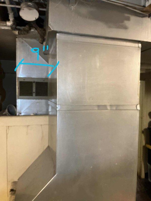 Conducted on-site evaluation of existing 30-year-old furnace system in basement of residential property to provide replacement estimate. Inspected large-capacity heating unit originally converted from wood-burning to gas operation, documented existing ductwork configuration including main plenum assembly and distribution system. Assessed current HVAC infrastructure for compatibility with new equipment installation and evaluated feasibility of adding central air conditioning system to property. Photographed existing equipment and ductwork layout for estimate preparation. No immediate operational concerns identified during inspection; system currently functioning without reported issues.