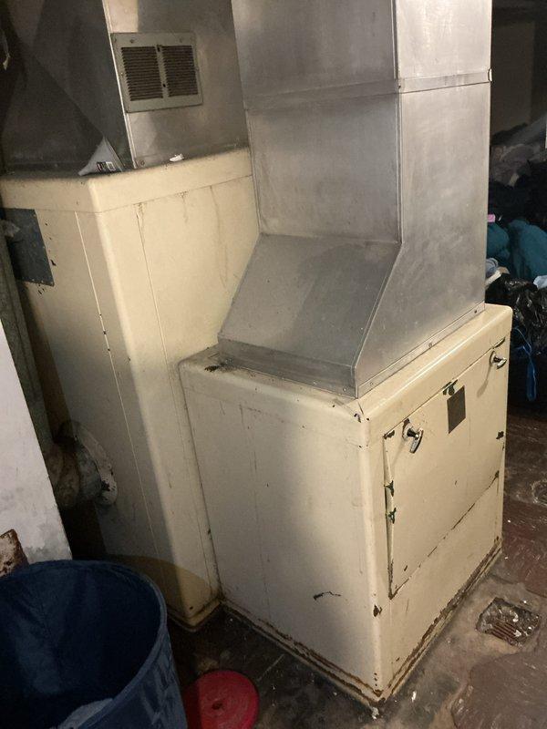 Conducted on-site evaluation of existing 30-year-old furnace system in basement of residential property to provide replacement estimate. Inspected large-capacity heating unit originally converted from wood-burning to gas operation, documented existing ductwork configuration including main plenum assembly and distribution system. Assessed current HVAC infrastructure for compatibility with new equipment installation and evaluated feasibility of adding central air conditioning system to property. Photographed existing equipment and ductwork layout for estimate preparation. No immediate operational concerns identified during inspection; system currently functioning without reported issues.