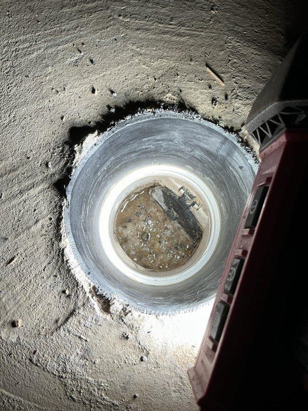 Responded to a drain backup issue at residential property. Upon arrival, assessed the main cleanout access point and determined the drainage system required mechanical clearing. Deployed power drain machine to address the blockage in the PVC drainage line. Successfully cleared the obstruction and restored proper drainage flow through the affected line. Verified system functionality upon completion.