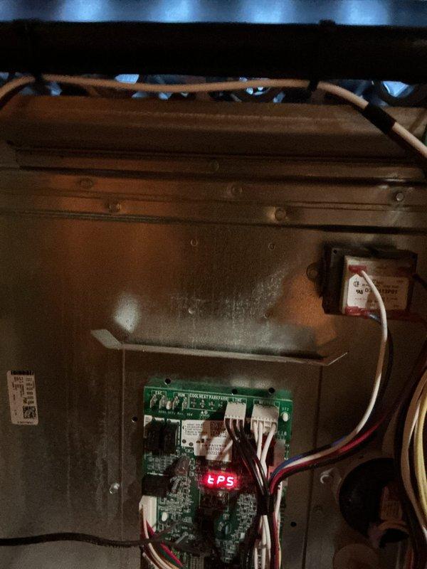 Responded to no heat call on recently installed furnace in basement. Upon arrival, confirmed thermostat was set to heat mode but furnace failed to respond. Inspected control board and found EPS error code displayed on LED. Traced issue to communication failure between thermostat and furnace control system. Discovered loose wire connection at thermostat base affecting R and C wire terminals. Secured all thermostat wiring connections and verified proper 24V signal to furnace board. Cycled system through heat call, confirmed ignition sequence initiated properly and burners fired. Verified blower operation and adequate airflow at supply registers. System restored to normal operation with proper heating cycle.