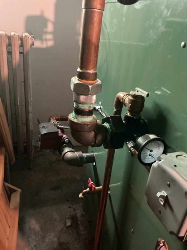 Completed comprehensive inspection and tune-up of steam boiler system installed in November 2022, located in basement. Inspected expansion tank, pressure gauge readings, copper piping connections, control valves, and associated ductwork for proper operation and safety compliance. All components found to be functioning within normal parameters with no immediate repairs required.