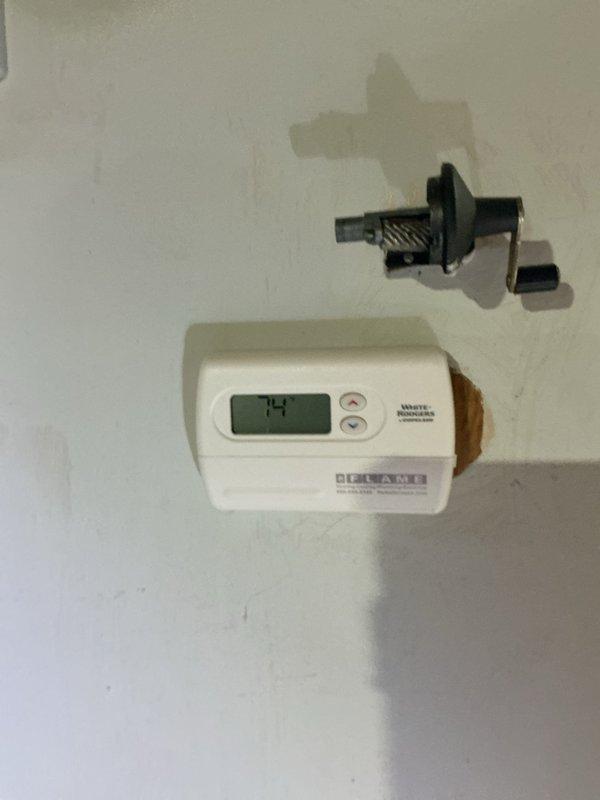 Completed warranty return visit for new electrical install to address three thermostats requiring attention. Upon removal of existing thermostats from wall, discovered active cockroach infestation within the wall cavities and thermostat housings. Coordinated with pest control service to ensure proper treatment was completed prior to proceeding with thermostat installation. Installed and programmed three Rite Temp digital thermostats, verified proper wiring connections, and confirmed all units were functioning correctly with accurate temperature readings displayed.