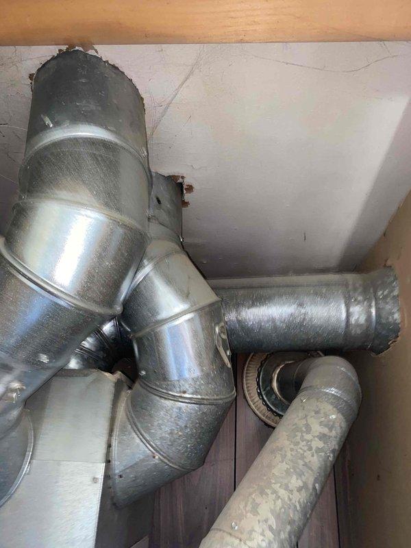 Conducted comprehensive inspection of dual-zone forced air heating system with equipment located on both levels of residence. Upon examination of upstairs furnace unit (10+ years old), identified critical heat exchanger crack presenting potential safety hazard and requiring immediate replacement recommendation. Evaluated electrical panel, ductwork configuration, and ventilation components throughout both zones. Documented existing HVAC infrastructure including metallic duct connections, circuit breaker allocation, and system integration points. Provided detailed replacement estimate for compromised upstairs furnace unit to ensure safe and efficient heating operation.
