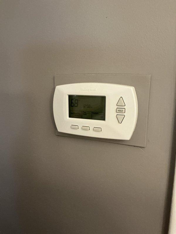 Completed pre-winter tune-up on 6-year-old furnace system located in basement mechanical room. Performed comprehensive inspection of all system components, verified proper operation of burners and heat exchanger, checked and cleaned blower assembly, tested safety controls and limit switches, inspected condensate drain lines and PVC venting system, and confirmed thermostat functionality showing proper temperature control at 69 degrees. All components operating within manufacturer specifications with no issues identified.