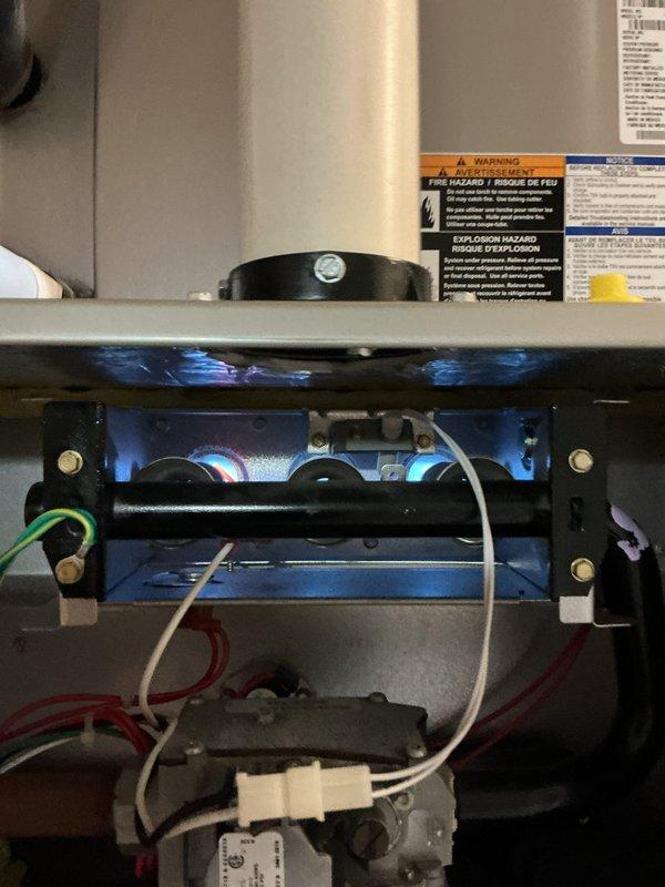 Completed comprehensive Gold-level furnace inspection on 10+ year old forced air unit located in basement. Inspected burner assembly with blue flame combustion chamber, verified proper ignition sequence, examined gas manifold and pressure settings, and checked all electrical connections including ignition controls and safety wiring. All components operating within normal parameters with no deficiencies noted at time of inspection.