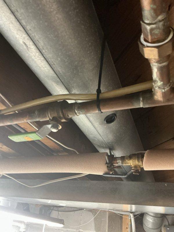 Performed preparatory plumbing work under kitchen sink in advance of dishwasher installation. Cleaned and serviced existing PVC drain assembly, including P-trap and associated fittings. Disconnected and removed old dishwasher unit, including water supply line and drain connections. Inspected copper supply lines and shutoff valves to ensure proper function for new appliance installation. Cleared cabinet space and verified all plumbing connections were secure and operational.