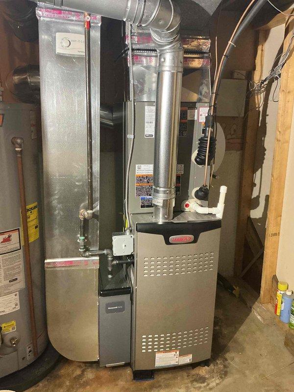 Completed full HVAC system installation including a 90,000 BTU high-efficiency furnace with humidifier and 2.5-ton rear-discharge air conditioning unit in basement mechanical room. Installed new Honeywell thermostat, ran electrical conduit and wiring to junction box, connected condensate drain lines, and integrated all ductwork connections. Secured mechanical, electrical, and plumbing permits prior to installation, performed all reconnections to existing infrastructure, tested system operation, and verified proper airflow and temperature control throughout residence.