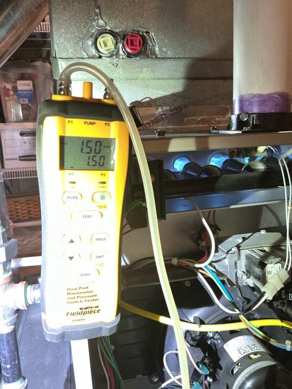 Completed comprehensive Gold Furnace Inspection on 10+ year old forced air unit located in basement. Performed diagnostic testing using digital manometer to verify gas pressure readings at 1.50 and 1.3 inches water column, and measured temperature differential readings of 34.8°F and 34.9°F across heat exchanger. Inspected control board with illuminated LED indicators confirming proper operation, examined electrical connections and wiring throughout system, and verified all safety controls functioning correctly. Unit operating within manufacturer specifications with no immediate repairs required at time of inspection.