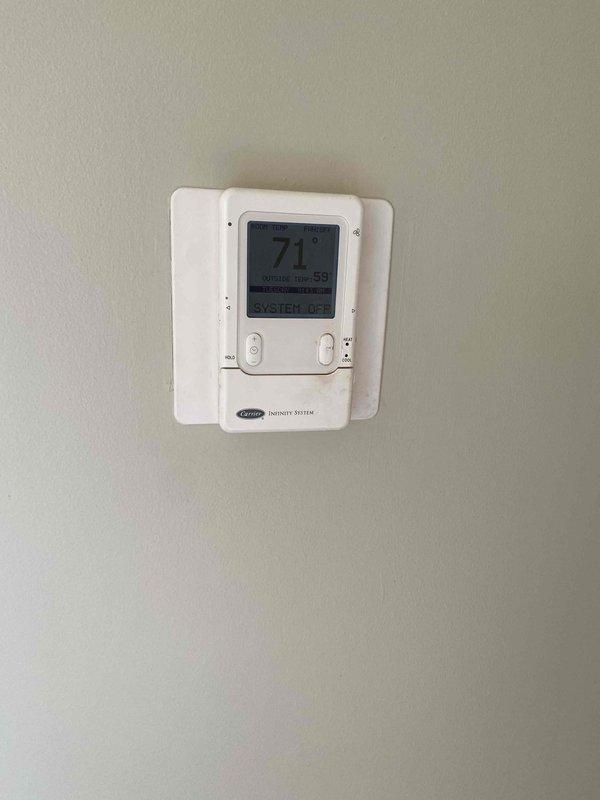 Provided estimate for replacement of 10+ year old natural gas furnace and humidifier system located in basement. Current equipment is operational but has reached end of expected service life. Assessed existing installation including ductwork, PVC venting, and Carrier Infinity thermostat system to determine replacement specifications and compatibility requirements.