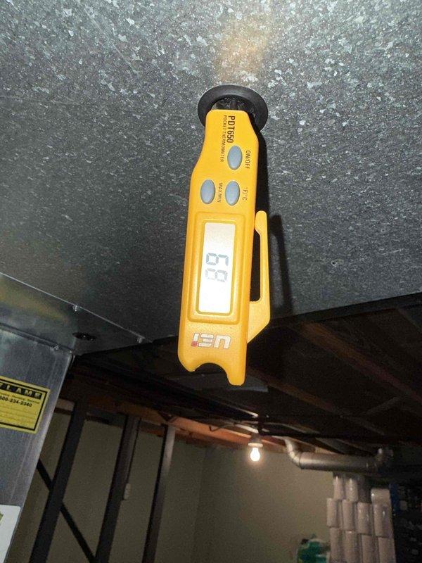 Completed comprehensive Gold Furnace Inspection on 16-year-old forced air heating system located in basement. Performed diagnostic temperature measurements at supply plenum registering 93°F and conducted thorough system evaluation using calibrated digital instrumentation. All components operating within normal parameters at time of inspection.