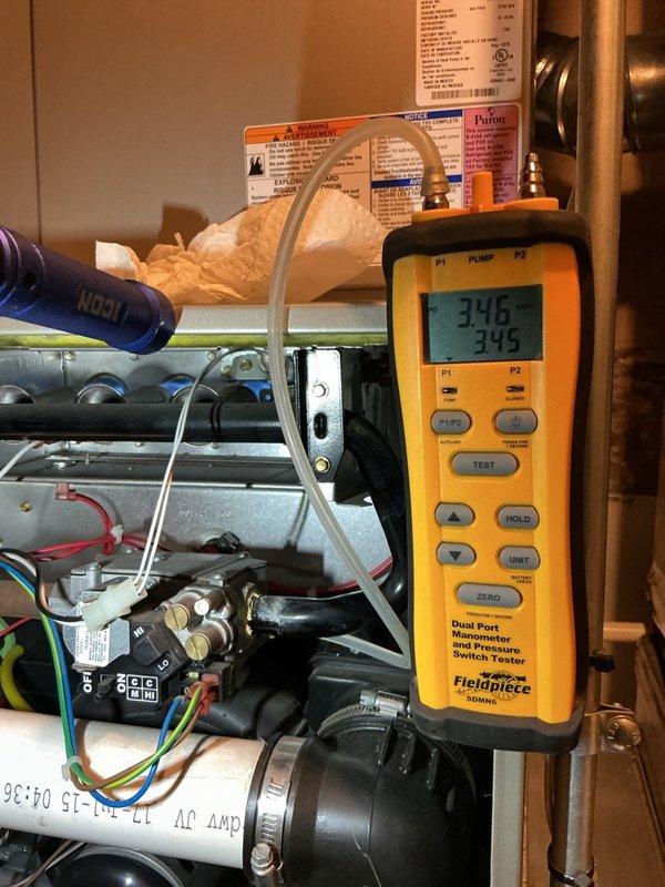 Completed comprehensive winter tune-up and inspection on a 10-year-old Bryant 2-stage Evolution furnace, model 926TA48080V17A-A, located in basement. Performed full system diagnostics including combustion analysis, gas pressure testing using dual port manometer which confirmed proper manifold pressure readings of 34.6 and 34.5, verified all electrical connections and control board operation, inspected heat exchanger for cracks or damage, cleaned burner assembly, checked and adjusted blower motor operation for both heating stages, tested ignition system and flame sensor, inspected and verified proper operation of gas valve and safety controls, examined venting system and condensate drain lines for proper function, replaced air filter, and confirmed all safety switches and limit controls operating within manufacturer specifications. All components tested and found operating efficiently with system ready for heating season.