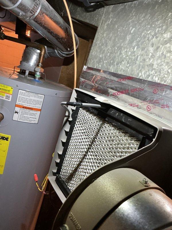 Completed comprehensive winter tune-up and inspection on a 10-year-old Bryant 2-stage Evolution furnace, model 926TA48080V17A-A, located in basement. Performed full system diagnostics including combustion analysis, gas pressure testing using dual port manometer which confirmed proper manifold pressure readings of 34.6 and 34.5, verified all electrical connections and control board operation, inspected heat exchanger for cracks or damage, cleaned burner assembly, checked and adjusted blower motor operation for both heating stages, tested ignition system and flame sensor, inspected and verified proper operation of gas valve and safety controls, examined venting system and condensate drain lines for proper function, replaced air filter, and confirmed all safety switches and limit controls operating within manufacturer specifications. All components tested and found operating efficiently with system ready for heating season.