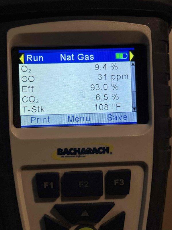 Completed comprehensive Gold furnace inspection on 10+ year old forced air unit located in basement. Performed combustion analysis using digital analyzer, recording optimal readings: 93.0% efficiency, 31 ppm CO, 9.4% O₂, 6.5% CO₂, and 108°F stack temperature. All measurements within acceptable parameters indicating proper combustion and system operation, with unit functioning normally at time of inspection.