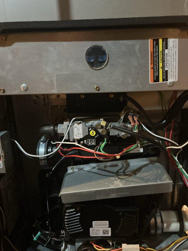 Completed Gold Plan preventative maintenance inspection on 15-year-old furnace located in basement. Performed comprehensive system diagnostics using combustion analyzer to measure flue gas temperatures, CO2 levels, and combustion efficiency. Inspected all internal components including heat exchanger, gas valve assembly, blower motor, electrical connections, and control board. Verified proper operation of all safety controls, checked wiring harnesses for wear or damage, and confirmed system is operating within manufacturer specifications. Unit found to be functioning properly with no immediate concerns identified.
