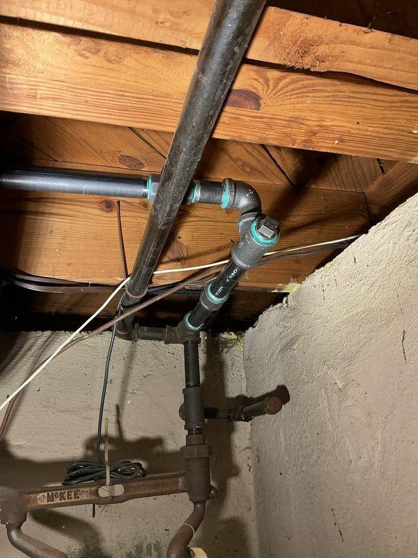 Completed gas line repairs in ceiling space as specified in estimate. Replaced deteriorated black iron pipe sections and installed new flexible couplings to ensure secure, leak-free connections. Secured all piping with proper metal straps and hangers attached to structural beams, bringing the system up to code compliance.