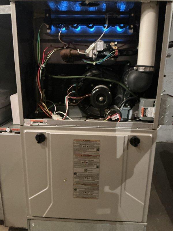 Completed comprehensive Gold-level preventative maintenance inspection on two gas furnaces in preparation for heating season. Basement unit: 10-year-old Bryant gas furnace underwent full tune-up including burner assembly inspection and cleaning, flame sensor cleaning, blower motor and capacitor testing, air filter replacement, thermostat calibration verification, and combustion analysis to ensure proper gas-to-air mixture and efficient operation. Verified all electrical connections, tested safety controls including limit switches and rollout sensors, and confirmed proper venting. Second-floor unit: 12-year-old furnace received identical comprehensive service protocol. Both units demonstrated proper ignition sequence with consistent blue flame patterns across all burner ports. Blower assemblies on both systems operating within manufacturer specifications with adequate amperage draw. All safety devices tested and functioning correctly. Condensate drainage systems inspected and confirmed 